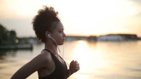 Woman running and listening to music