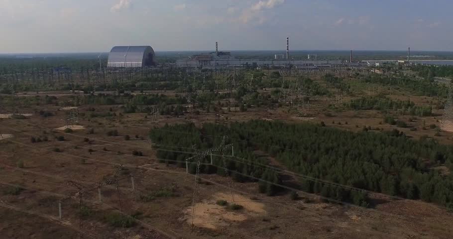Chernobyl's arch. Aerial, 4K. The New Safe Confinement  is a structure intended to contain the nuclear reactor at Chernobyl, Ukraine, part of which was destroyed by the Chernobyl disaster in 1986.  Royalty-Free Stock Footage #11210705