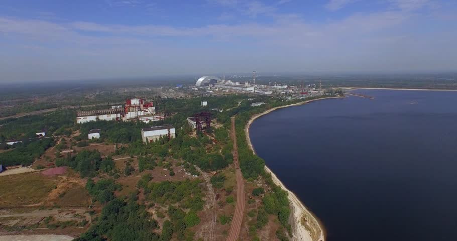 Chernobyl's arch. Aerial, 4K. The New Safe Confinement  is a structure intended to contain the nuclear reactor at Chernobyl, Ukraine, part of which was destroyed by the Chernobyl disaster in 1986.  Royalty-Free Stock Footage #11210708
