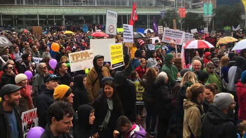 AUCKLAND - AUG 15 2015:Thousands march against TPP trade agreement in Auckland.12 nations including New Zealand have been negotiating the TTP trade deal, which would cover 40% of the world economy.