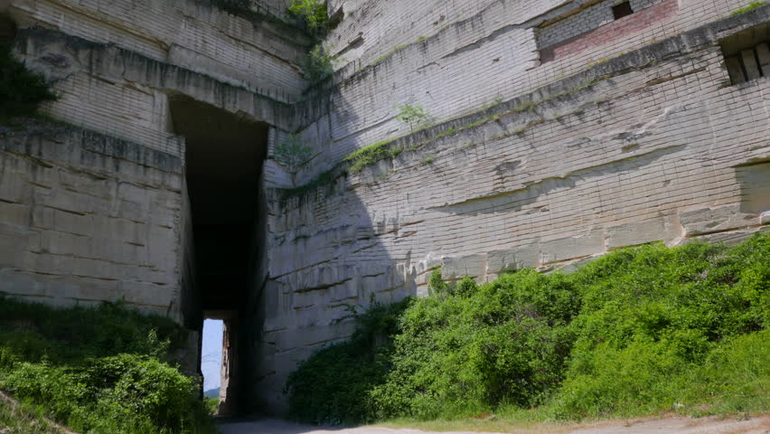 Tunnel in the mountain in an abandoned limestone quarry. Shooting movies in 4K. The shutter speed is 1/50. With the use of ND-filter.