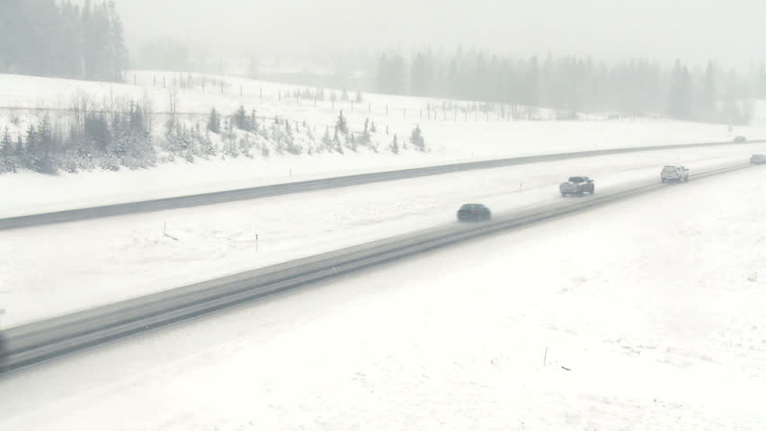 Highway truck traffic during blizzard