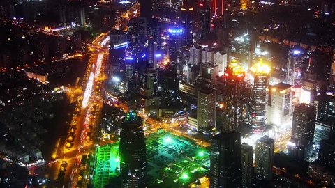 Elevated view of urban traffic & brightly lit high-rise buildings at night in Shanghai,China,time lapse.  gh2_07626
