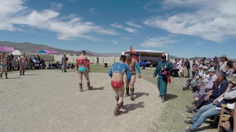 Tsagaannuur, mongolia - july 8 2015: Mongolian wrestling to celebrate the national holiday of Naadam, Tsagaanuur, a report from the beginning of the competition, where wrestlers are only heated under the blue sky July 8, 2015