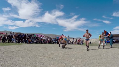 Tsagaannuur, mongolia - july 8 2015: Mongolian wrestling to celebrate the national holiday of Naadam, Tsagaanuur, a report from the beginning of the competition, where wrestlers are only heated under the blue sky July 8, 2015