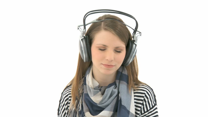 Beautiful woman listening to music with headphones