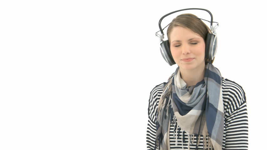 Beautiful woman listening to music with headphones