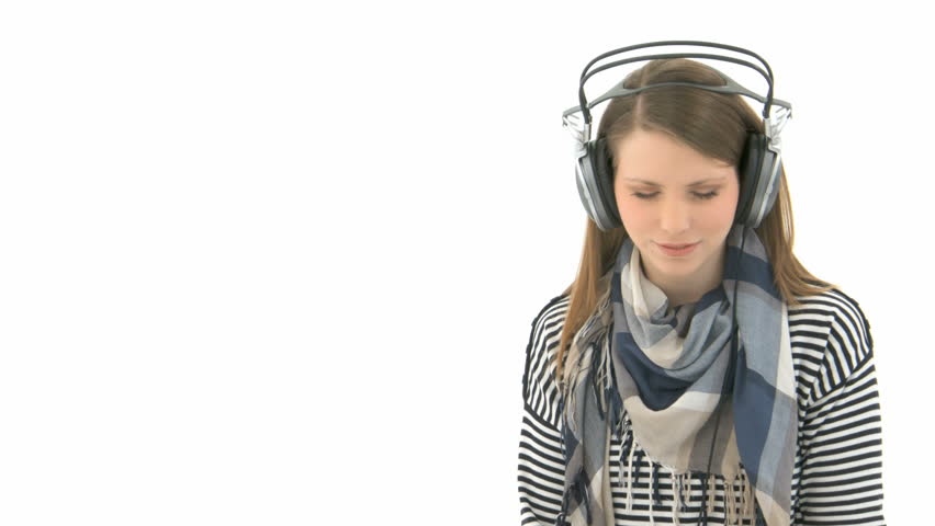 Beautiful woman listening to music with headphones