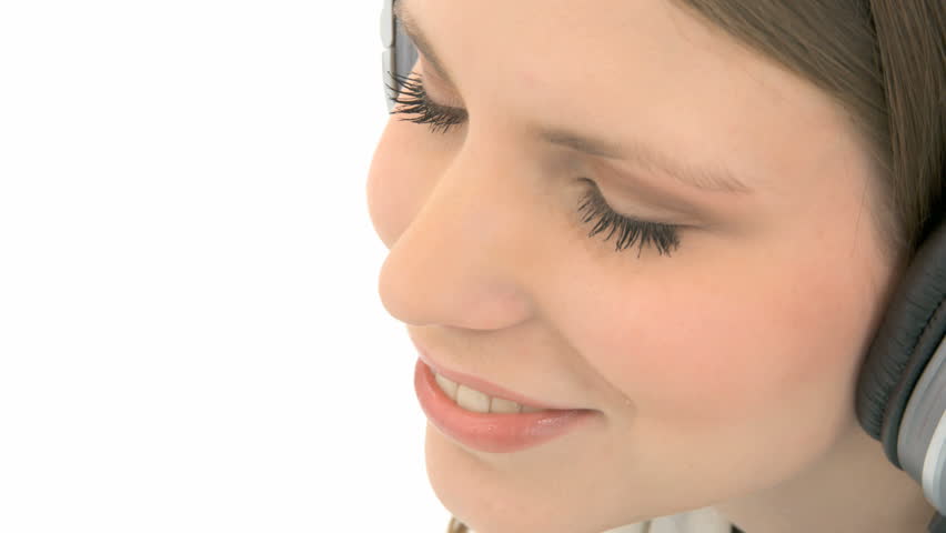 Beautiful woman listening to music with headphones