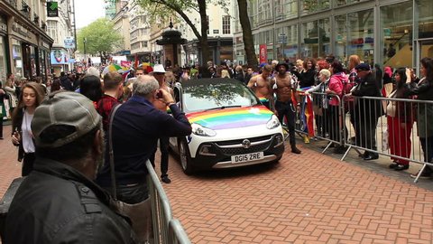Birmingham Gay Pride 2015, England - semi naked, muscular guys with a rainbow wings