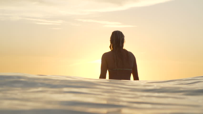 Surfer Girl Waiting for Wave At Sunset 