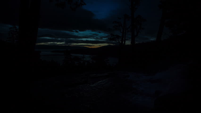 Time lapse at Eagle Falls over looking Lake Tahoe at Sunrise, as the clouds light up and snow blows in. Emerald Bay is just below.