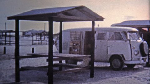 KEY WEST, FL -1971: Hippie VW van parked beach girls scenes.