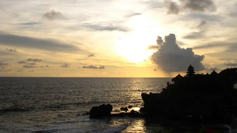 Time lapse sunset over Bali ocean at famous Sea Temple Tanah Lot