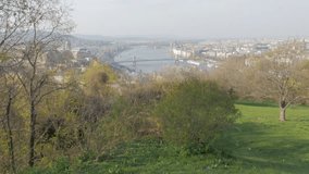 City scape of Budapest and river Danube from Gellert hill slow tilt 4K 3840X2160 30fps UltraHD  footage - Hungarian capital Budapest by the day from Buda side 4K 2160p UHD video