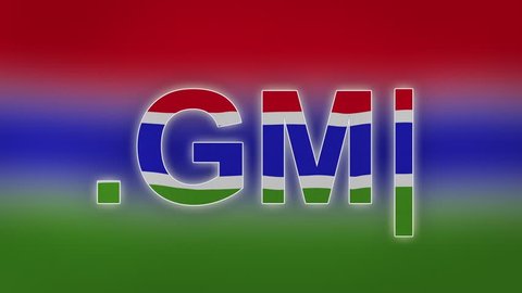 GM - internet domain of Gambia. Typing top-level domain “.GM” against blurred waving national flag of Gambia. Highly detailed fabric texture for 4K resolution.