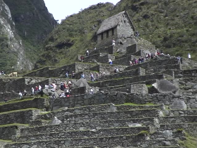 Crowds of tourists at the classic viewpoint of the Ancient Inca city of Machu Picchu, Peru.