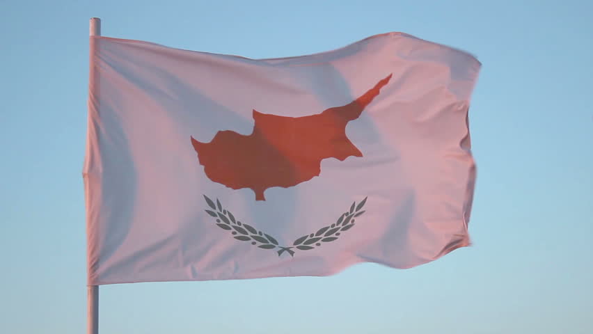 Flag of Cyprus flapping in wind, national symbol against blue sky, loopable shot