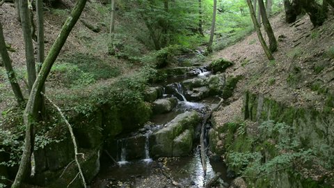 wild stream Brodenbach next to Mosel River. Waterfalls and stones. wild landscape. (Germany, Rhineland-palatinate)