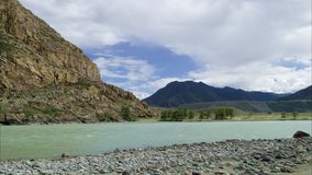 Picturesque mountain river Katun of turquoise  color in Altai (Siberia) with cloudy sky. 4k timelapse (ultra hd 4096x2304).