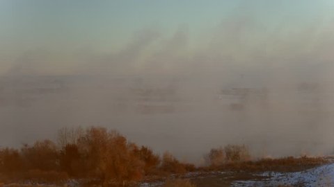 Steam Fog. Cold air flowing above a still warm lake on an autumn morning results in steam fog drifting downwind. These fog banks can often surprise unwary motorists and cause major traffic accidents.