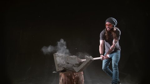 Man smashing cement block with hammer in slow motion, shot on Phantom Flex 4K at 1000 fps