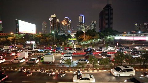 Heavy traffic in Jakarta central business district at night. Jakarta is Indonesia capital city and is ranked among the worst in the world for traffic congestion. Time lapse video