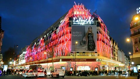 PARIS - DEC 30, 2014: Christmas decorated Galeries Lafayette department store on the Boulevard Haussmann on December 30, 2014 in Paris, France. Galeries Lafayette building was officially open in 1912.