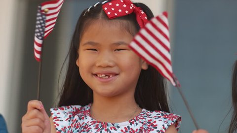 Young girl waving American flag, shot on Phantom Flex 4K – Stockvideo