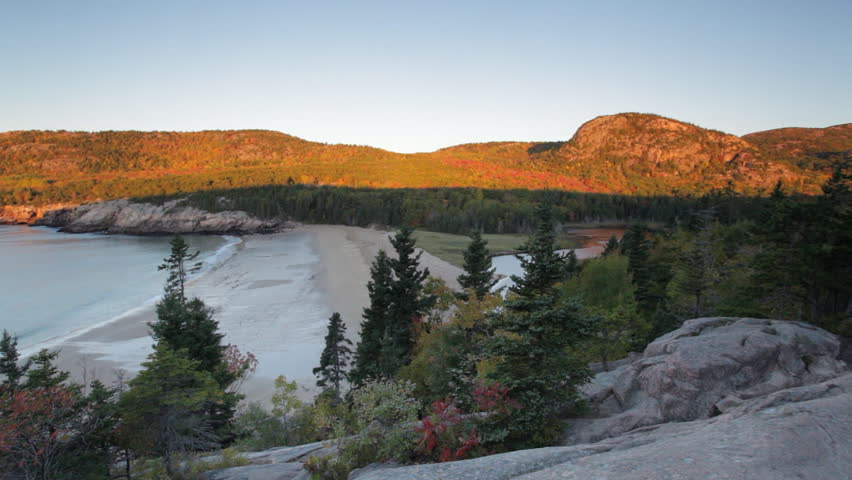 Panning view of The Beehive, Sand Beach, Newport Cove, and Gorham Mountain at first light in Autumn in Acadia National Park, Maine.