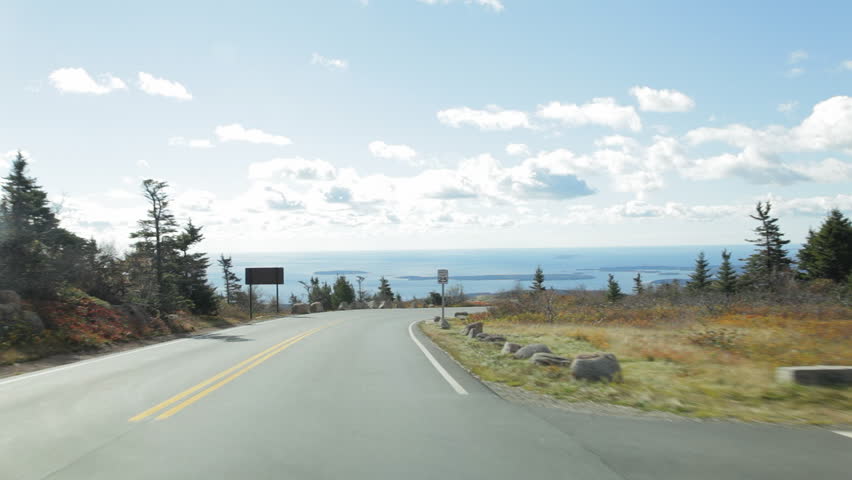 Point-of-view clip driving on Cadillac Summit Road (part of Park Loop Road) in autumn in Acadia National Park, Maine, USA.
