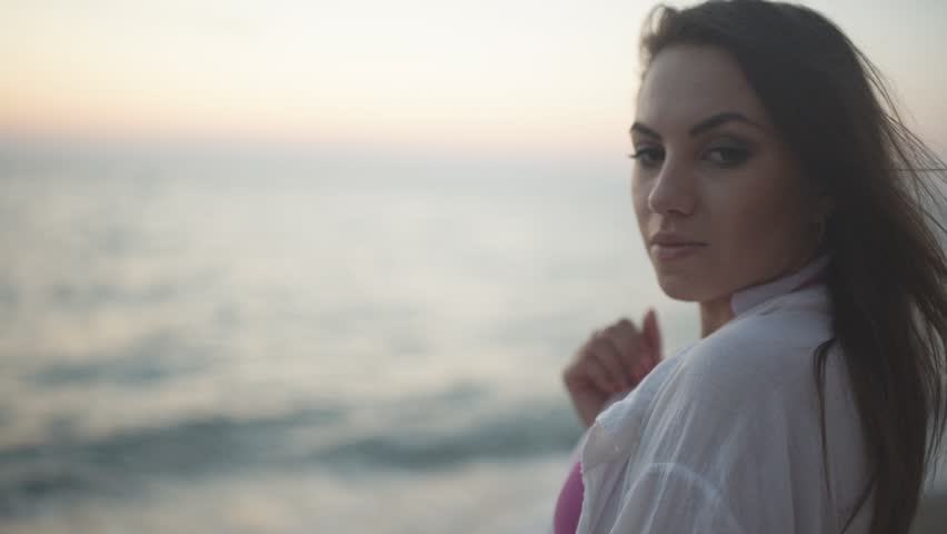 Beautiful girl in bikini posing for the camera and seduces