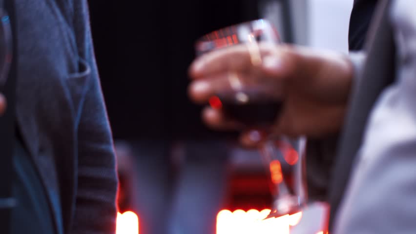 Succesful businessmans talking about business and drinking wine