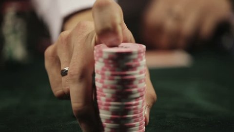 Casino, poker: Man playing poker doing call. Close up