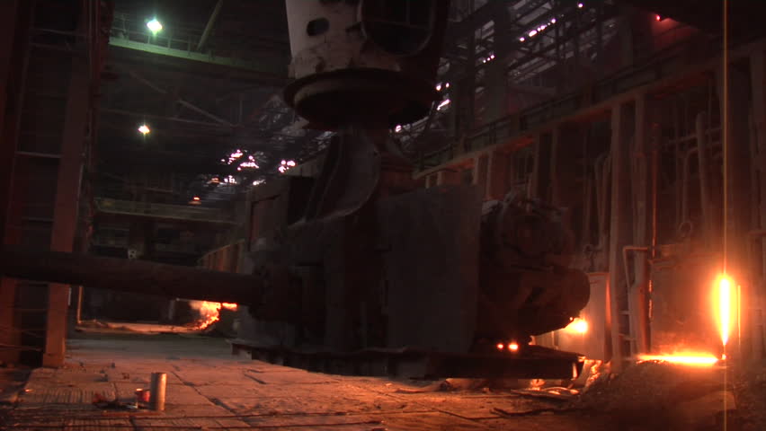 Worker is Passing By Machine is Loading The Coal Into The Blast Furnace Light from the Furnace Boiling Metal Melting Metal, Donetsk Metallurgical Plant, Pouring of Liquid Metal from Ore, Metal Royalty-Free Stock Footage #11345078