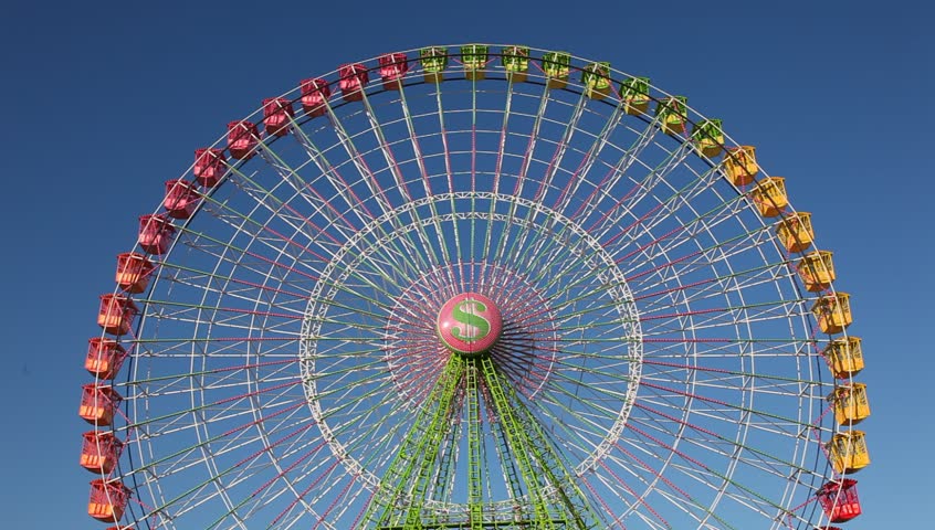 Colorful ferris wheel against blue sky Royalty-Free Stock Footage #1134736