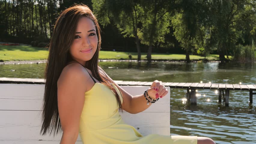 portrait of a beautiful brunette woman outdoors