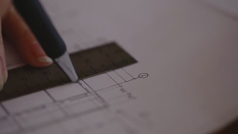 Macro super Close-up camera on the slider along the video, we see the blueprint, making notes in tablet range with the help of which made line drawings and a huge A3 drawing volumes.