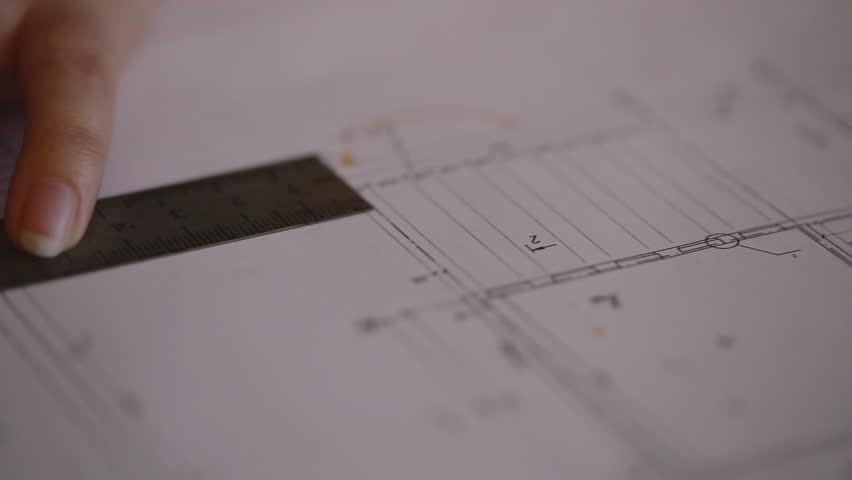 Macro super Close-up camera on the slider along the video, we see the blueprint, making notes in tablet range with the help of which made line drawings and a huge A3 drawing volumes. Royalty-Free Stock Footage #11360228