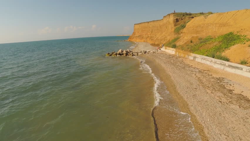 Aerial on the coast over the sea