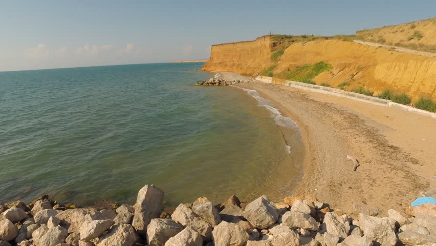 Aerial on the coast over the sea