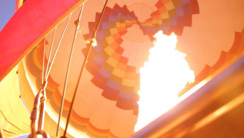 Firing up the balloon right before take off in the sky riding high