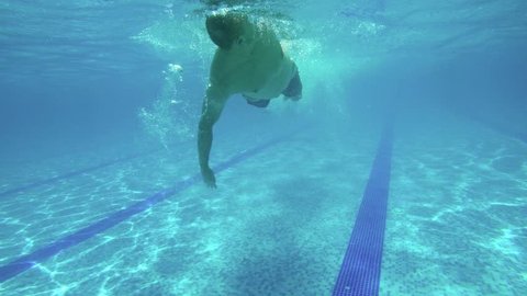 Underwater view professional swim training in swimming pool, freestyle crawl uhd 4k stock footage