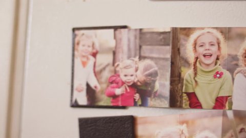 Close up of family photos on a fridge