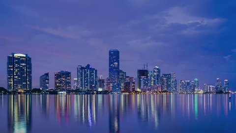 Miami, Florida skyline over Biscayne bay from day to night. 