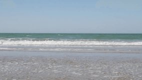 Tide waves spreading on the ocean beach 4K 2160p 30fps UltraHD video - Sea coastline wavy water by the day 4K 3840X2160 UHD footage