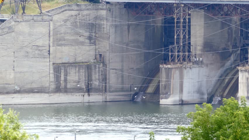 The dam of  Novosibirskaya hydro power plant  with flying seagulls- Ultra hd 3840x2160.