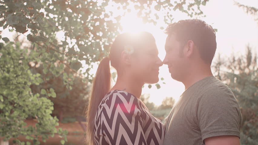 Получите стоковое видео "Romantic Couple Standing Their Foreheads Toge...