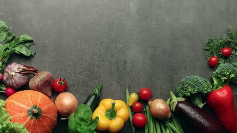 Moving vegetables on kitchen table, harvest background - stop motion animation