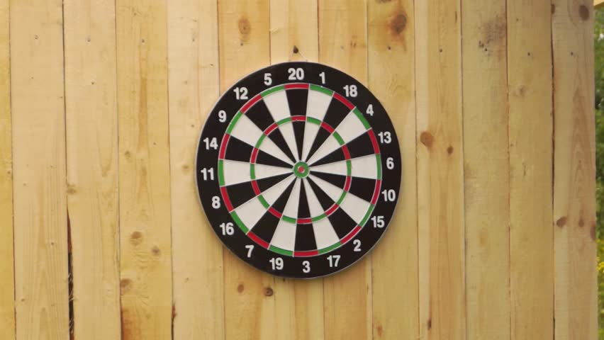 Someone throws a dart misses dart board Royalty-Free Stock Footage #11401646